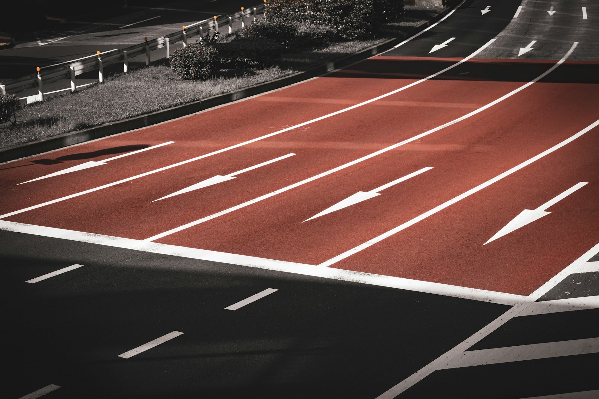 a red running track with white markings on it